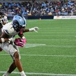 Buchanan brings the ball in to his body as the Brown defender reached in to try to dislodge the pass.