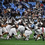 It was a very physical game on both sides of the ball.  Rohan Davy going low to make the stop while #53 is being pulled by the shirt, it happens more times than anyone can count.  The competition is fierce. and any advantage is sought after.