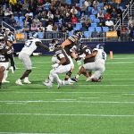 Captain AJ Pena with the tackle for loss.