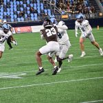 "Here Comes Barrow" with WR Greg Gaines blocking downfield.