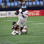 Antwain Littlelton breaks a tackle on his way toward a 13 yard gain.  He rushed for 60 yards and 38 yards receiving.