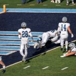 8th in this series, Farrell under a UNH defender - in the endzone already.