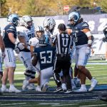 The umpire has to get between these big men!