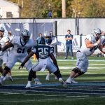 Rohan surveys the scene, keeping the UNH QB in his sights for a possible run...but with all of the blockers and few rushers, not a lot of pressure...3:49:06