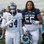 "We know each other..."#56 Dontay Bishop from URI and #94 Chief Ebana from UNH after the game.