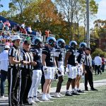 Captains line up for opening kickoff and ceremonial coin toss.