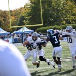 Setting the edge isn't so easy when a big guy is holding you up by the shirt and shoulder pads, but not to worry Rohan Davy catches up to the QB from the backside.