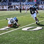 The UNH QB, Matt Vezza had Vezza,Matt led the Wildcats with 16 rushes for 62 yards, he was sacked twice.  He is a hard player to bring down, here Rohan Davy with AJ Pena in pursuit take care of business.