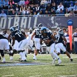 Looking downfield and evaluating his run option, Devin Farrell was superb this day against UNH.  There is more of him running coming up!