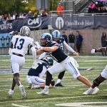 Special teams blocking helped Garth White hit 5 of 5 PAT's.  OL Nick Thomas (BC) takes on one defender while watching Christian take on UNH #13.