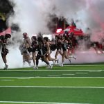 The Cheer and Spirit Groups lead the players on to the field at the Citrus Bowl.