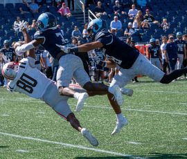 URI's Trey Lubin #3 and Andre DePina-Gray combine to break up a pass intended for Brown wide receiver Saphir Miller #80 during the Rams' Governor's Cup victory over the Bears at Centreville Bank Stadium in Pawtucket