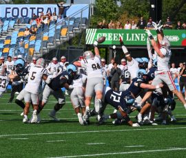 Ty Goff gets his kick away against a leaping Brown defense with 15 seconds remaining, sending the game-winning field goal through the uprights to give URI a victory over the Bears