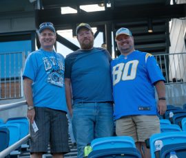 A big win brings big smiles! 3 Long time supporters and URI fans.